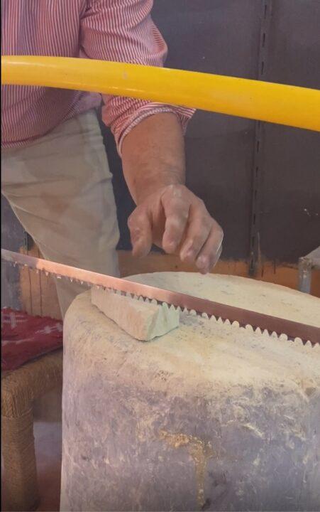 Cutting rough limestone with a saw