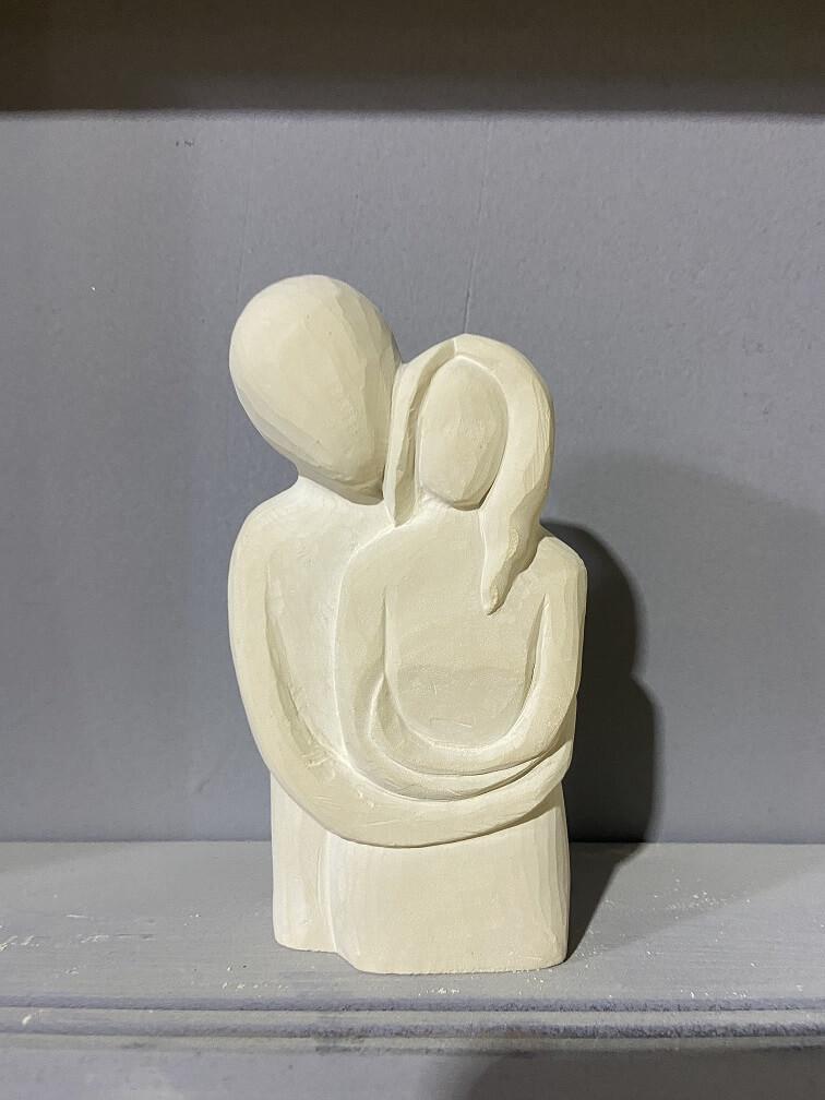 Limestone couple sculpture